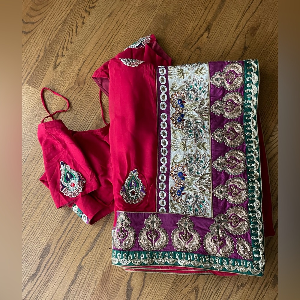 Red saree with matching blouse.
